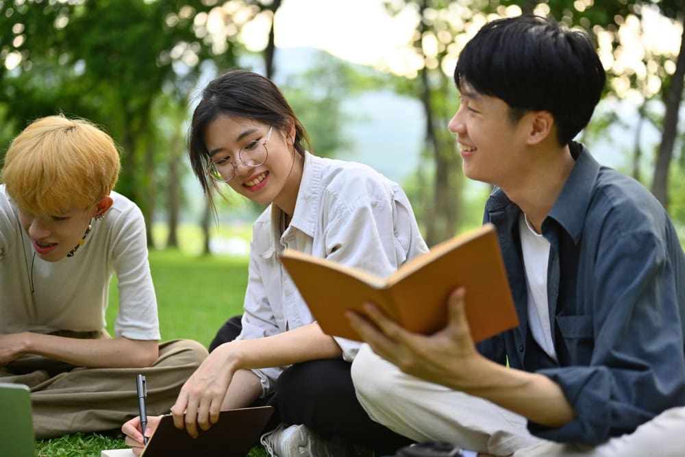 Students discussing A-Level vs IB and AP vs IB programme options before choosing their pathway.